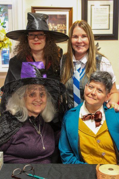 Four ladies wearing costumes.